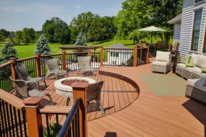 Elevated custom wood deck featuring a built-in fire pit and seating area in a Greater Cincinnati backyard
